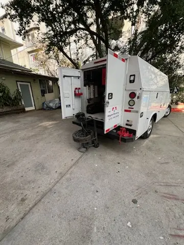 Magnet Plumbing service vehicle on-site for Grease Trap Cleaning in Westlake